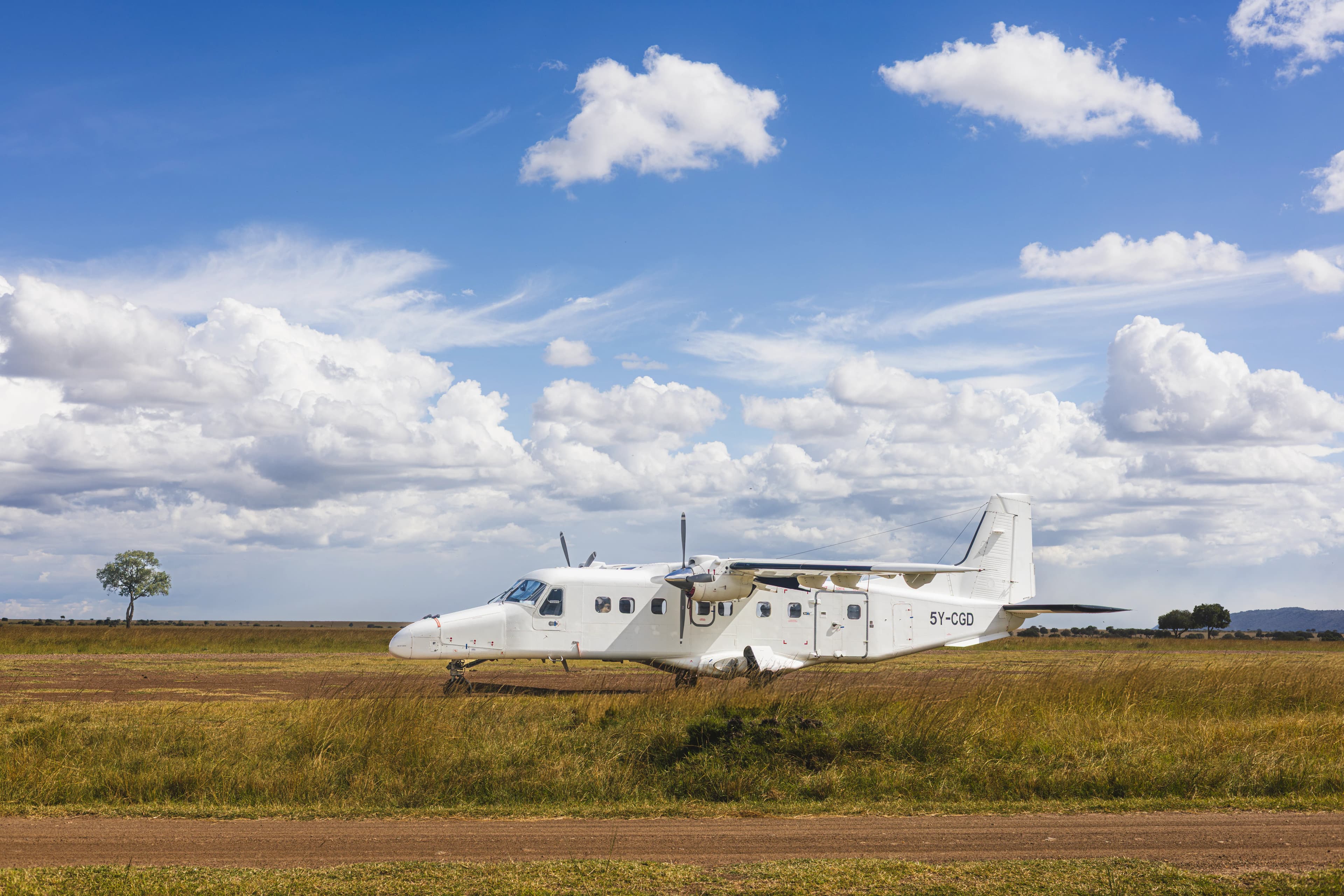 Safari charter approaching Amboseli with Kilimanjaro backdrop