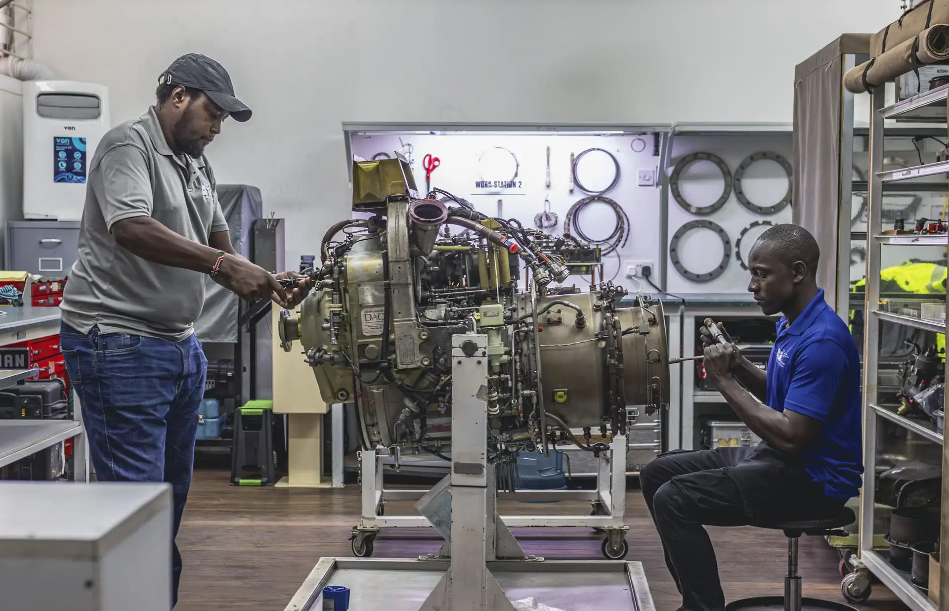 Aircraft maintenance engineer inspecting jet engine